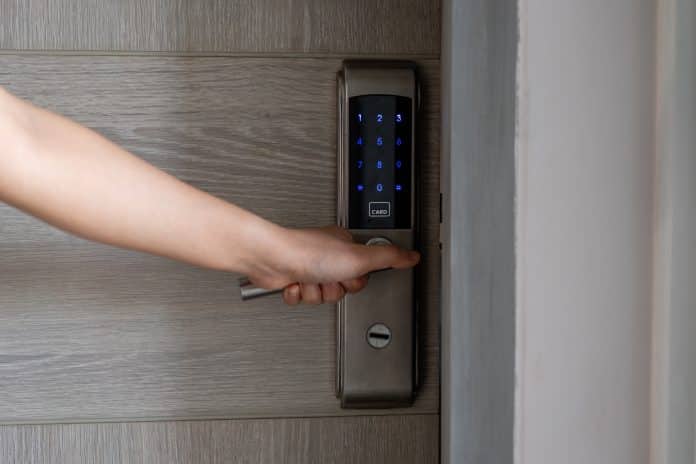Electronic card key for open door in hotel. Smart card key to lock and unlock door. Security systems and protection concept. Serrure connectée